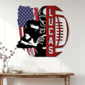 Football metal wall sign displayed on a white paneled wall above a wooden console table