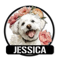 Fluffy Bichon Frise portrait surrounded by colorful flowers on a round metal sign