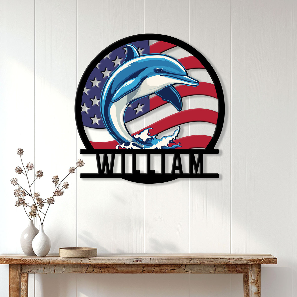 Patriotic dolphin wall sign displayed as coastal decor above a console table in a bright home