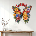 Colorful butterfly wall sign displayed above a console table in a bright, modern home interior