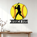 Softball wall sign displayed on a white paneled wall above a console table in a bright home