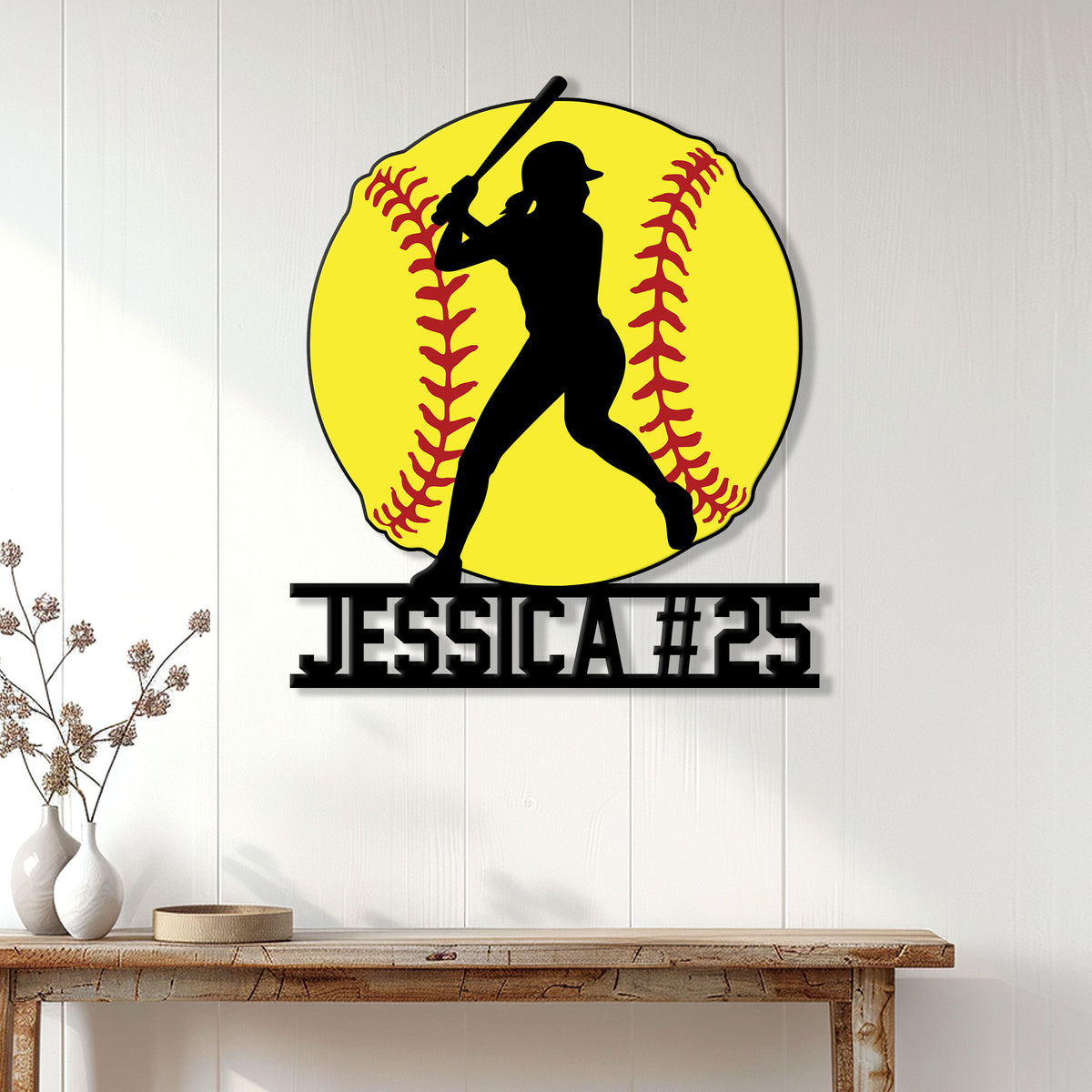 Softball wall sign displayed on a white paneled wall above a console table in a bright home