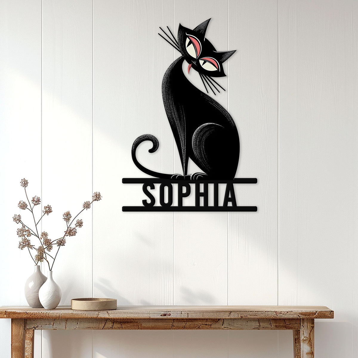 Black cat metal wall sign displayed on a light paneled wall above a rustic console table