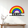 Rainbow LGBTQ Pride metal sign displayed on a light paneled wall above a console table