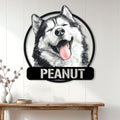 Alaskan Malamute metal wall sign displayed above a console table in a bright home entryway