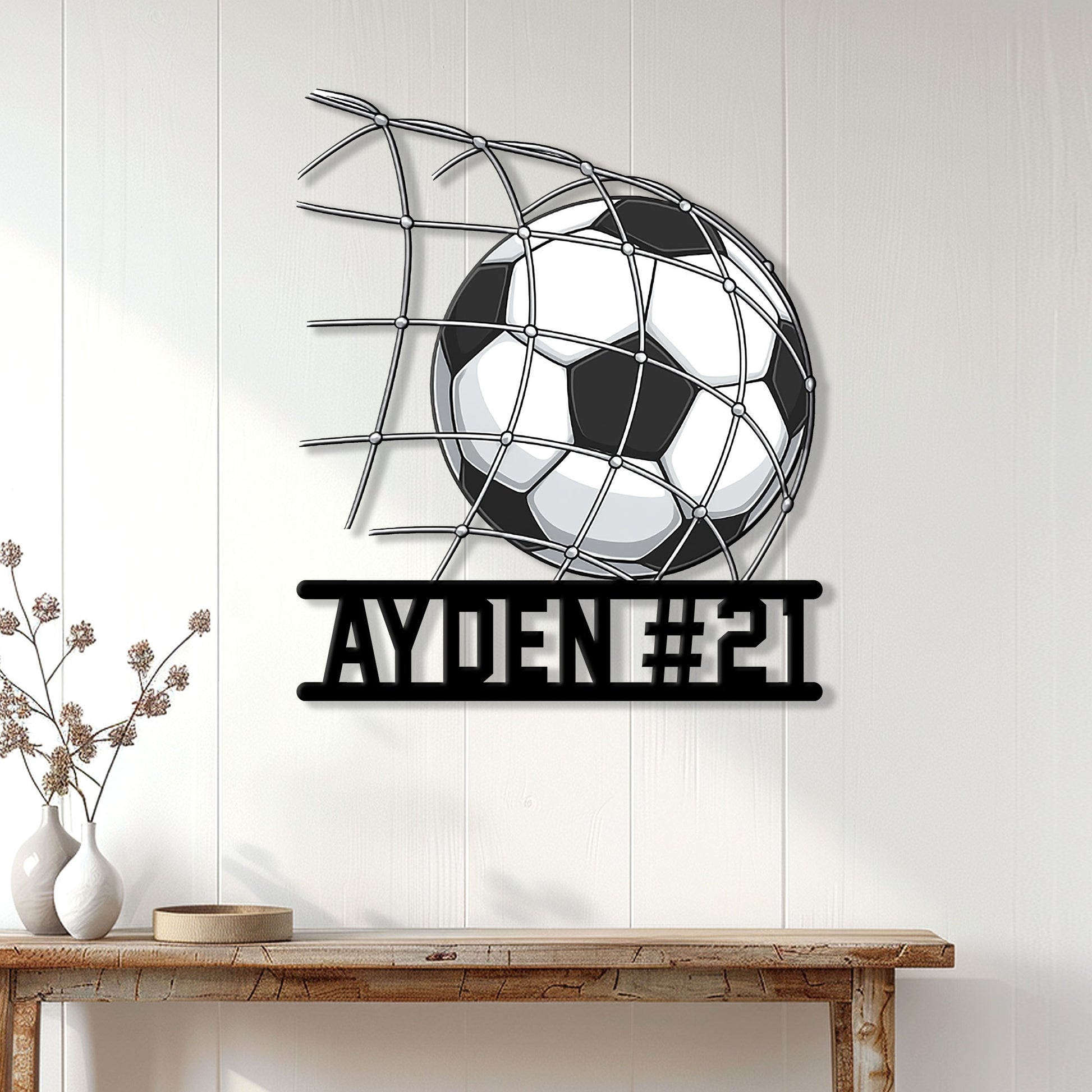 Soccer metal wall sign displayed on a bright paneled wall above a console table