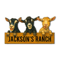 Custom goat ranch metal sign featuring three playful goats peeking over a rustic signboard