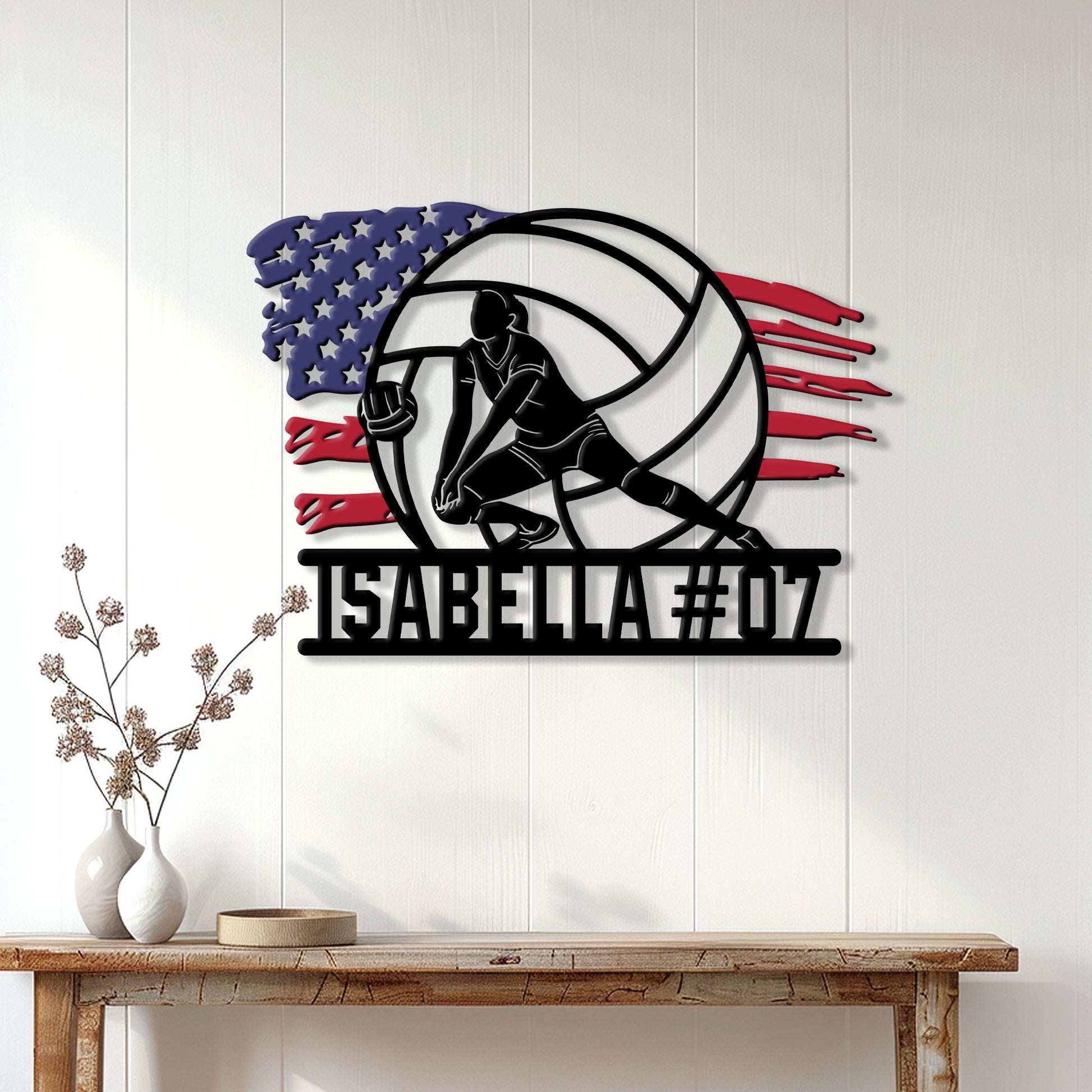 Volleyball athlete metal wall sign displayed on a light paneled wall above a rustic console table