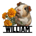 Guinea pig metal sign featuring a realistic cavy holding bright orange marigold flowers