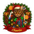 Maine Coon cat metal sign wearing a Santa hat with gifts, holly, pinecones, and colorful Christmas lights