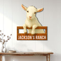 Goat ranch wall sign displayed on white farmhouse paneling above a rustic console table