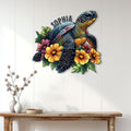 Sea turtle and tropical flower metal wall sign displayed above a wooden console table