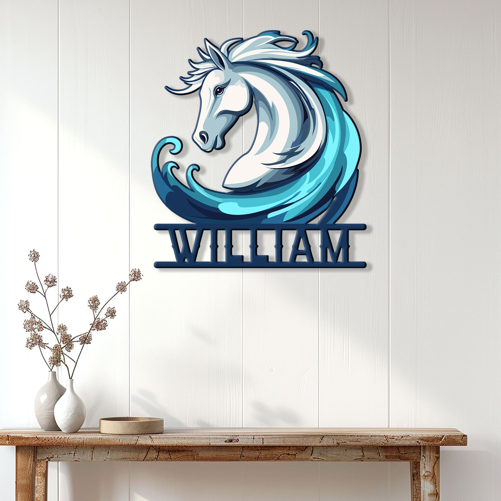 Horse and ocean wave metal wall sign displayed on a light paneled wall above a rustic console table
