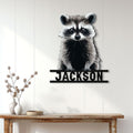 Raccoon metal wall sign displayed above a console table in a bright home entryway