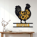 Floral hen metal sign displayed on a light wood-paneled wall above a console table in a farmhouse interior