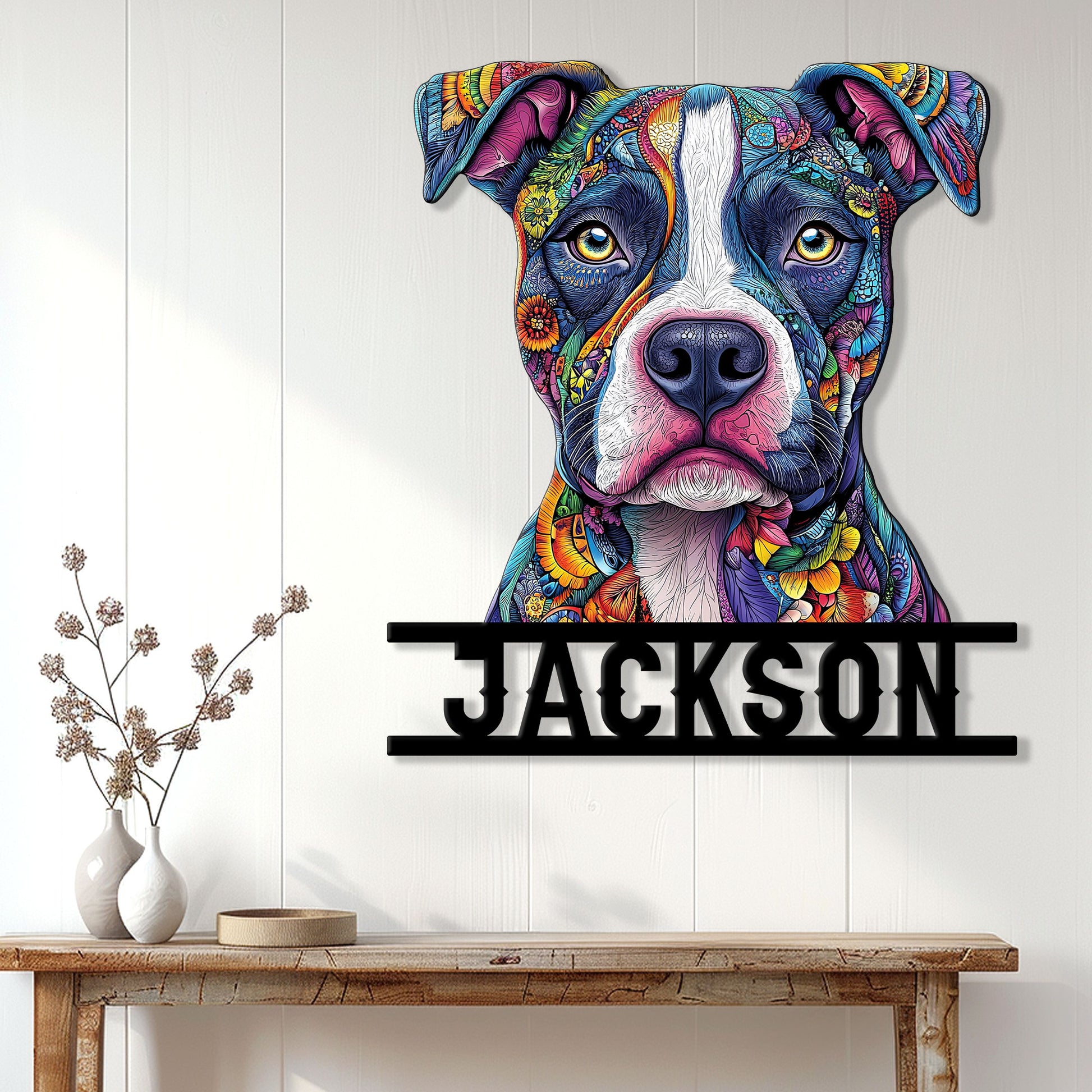 Colorful pitbull wall sign displayed on a light wood-paneled wall above a console table