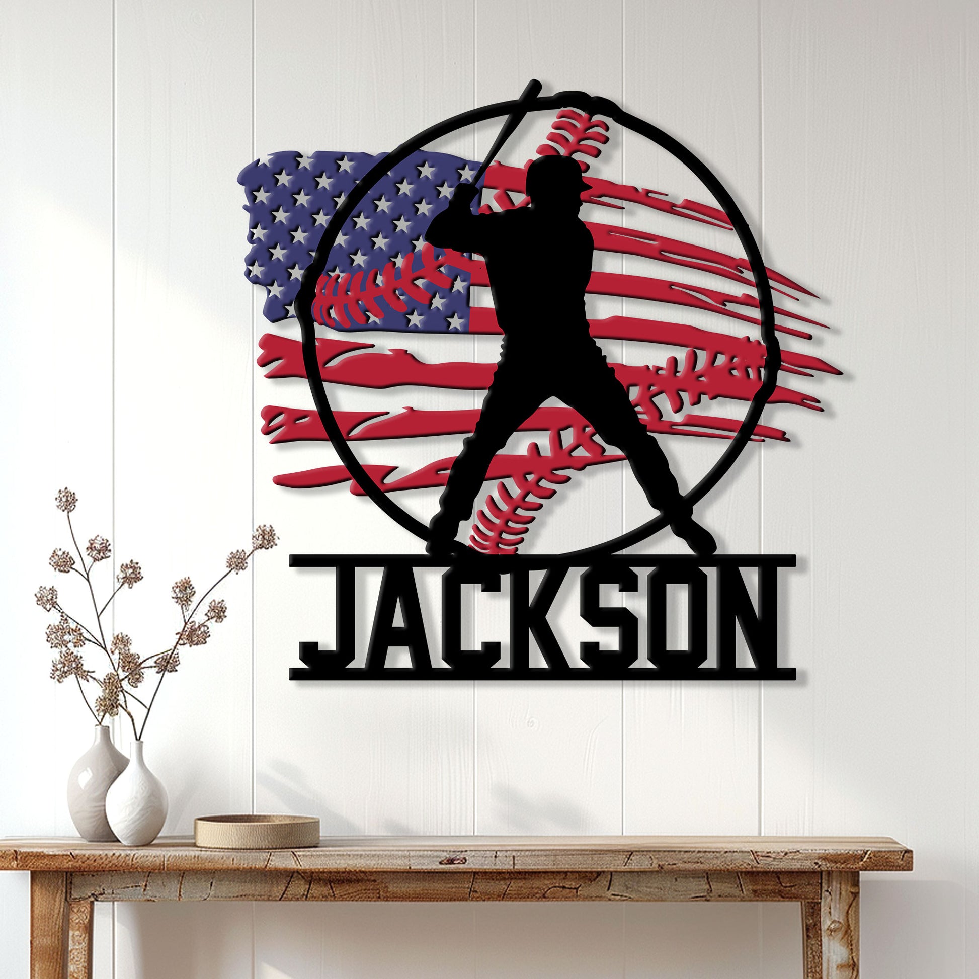 Patriotic baseball metal sign displayed on a white paneled wall above a rustic console table