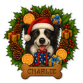 Christmas Border Collie metal sign featuring a Santa hat, gifts, holly, pinecones, and a bone-shaped plaque
