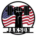 Patriotic weightlifting metal sign featuring a raised fist lifting a barbell over an American flag
