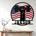 Weightlifting wall decor displayed above a console table, featuring a raised fist and American flag design