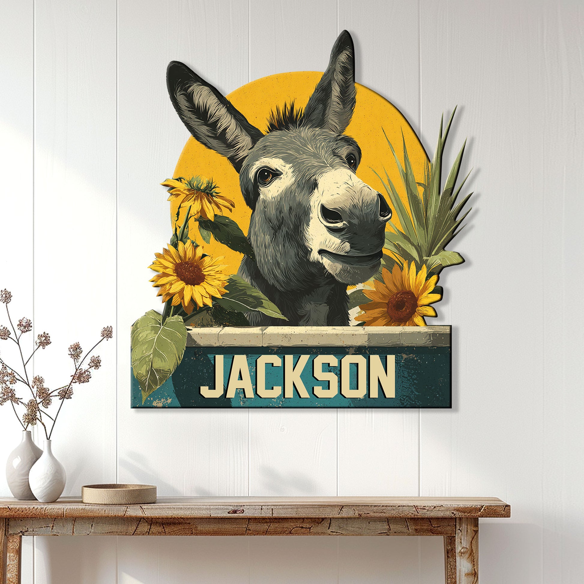 Donkey wall sign displayed on white paneling above a console table in a bright home entryway
