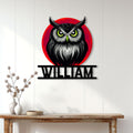 Fierce owl metal wall sign displayed on a light wood-paneled interior wall