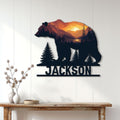 Bear metal wall sign displayed on a white paneled wall above a console table
