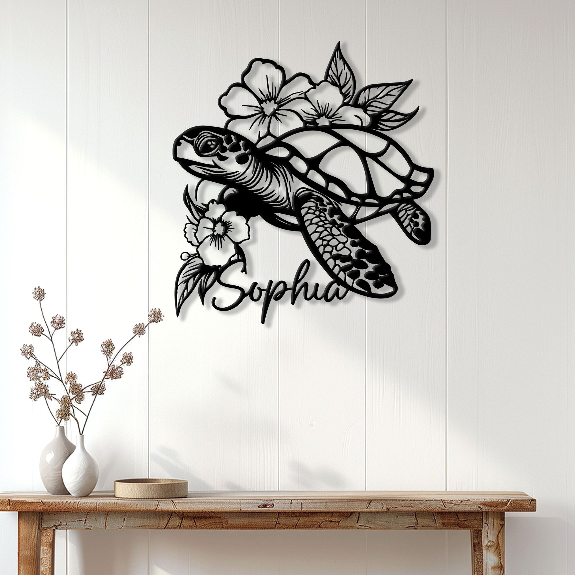 Floral sea turtle wall sign displayed above a console table in a bright, modern home