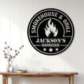 BBQ wall sign displayed on a light paneled wall above a rustic console table