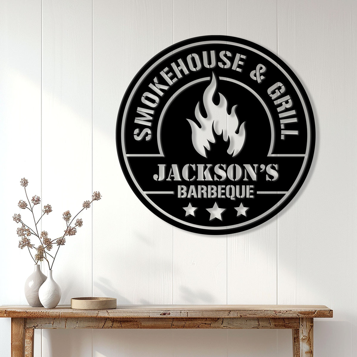 BBQ wall sign displayed on a light paneled wall above a rustic console table