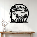 Mountain camping wall decor displayed on a light wood wall above a console table