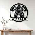 ATV wall sign displayed on a light wood-paneled wall above a console table