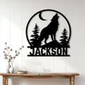 Howling wolf metal wall sign displayed above a console table in a bright home interior