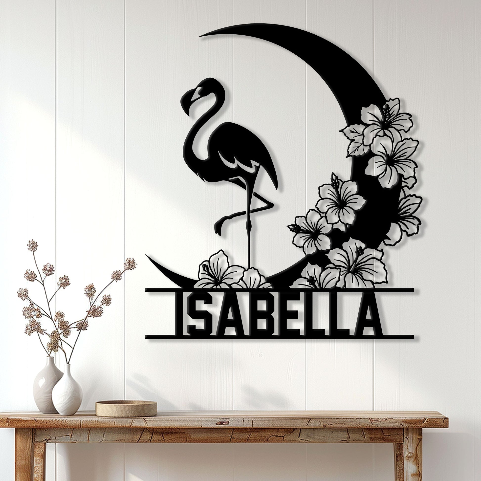 Flamingo wall decor displayed on a light wood-paneled wall above a console table