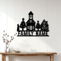 Custom Christmas village metal sign displayed on a light wood wall above a console table in a cozy entryway