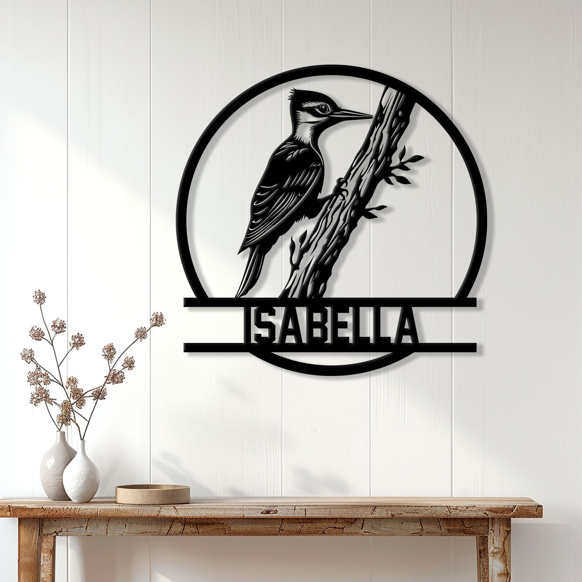 Woodpecker wall sign displayed above a console table in a bright, modern home interior