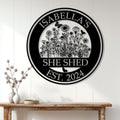 She Shed garden sign displayed on a white paneled wall above a rustic console table