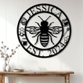 Honeybee metal wall sign displayed on white shiplap above a rustic console table in a bright home