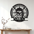 Pirate skull and compass metal sign displayed as dramatic wall decor above a console table