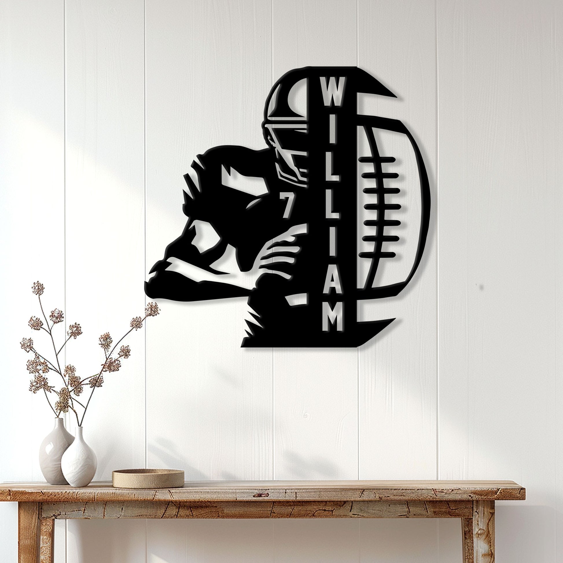 Football player metal wall sign displayed on a bright paneled interior wall