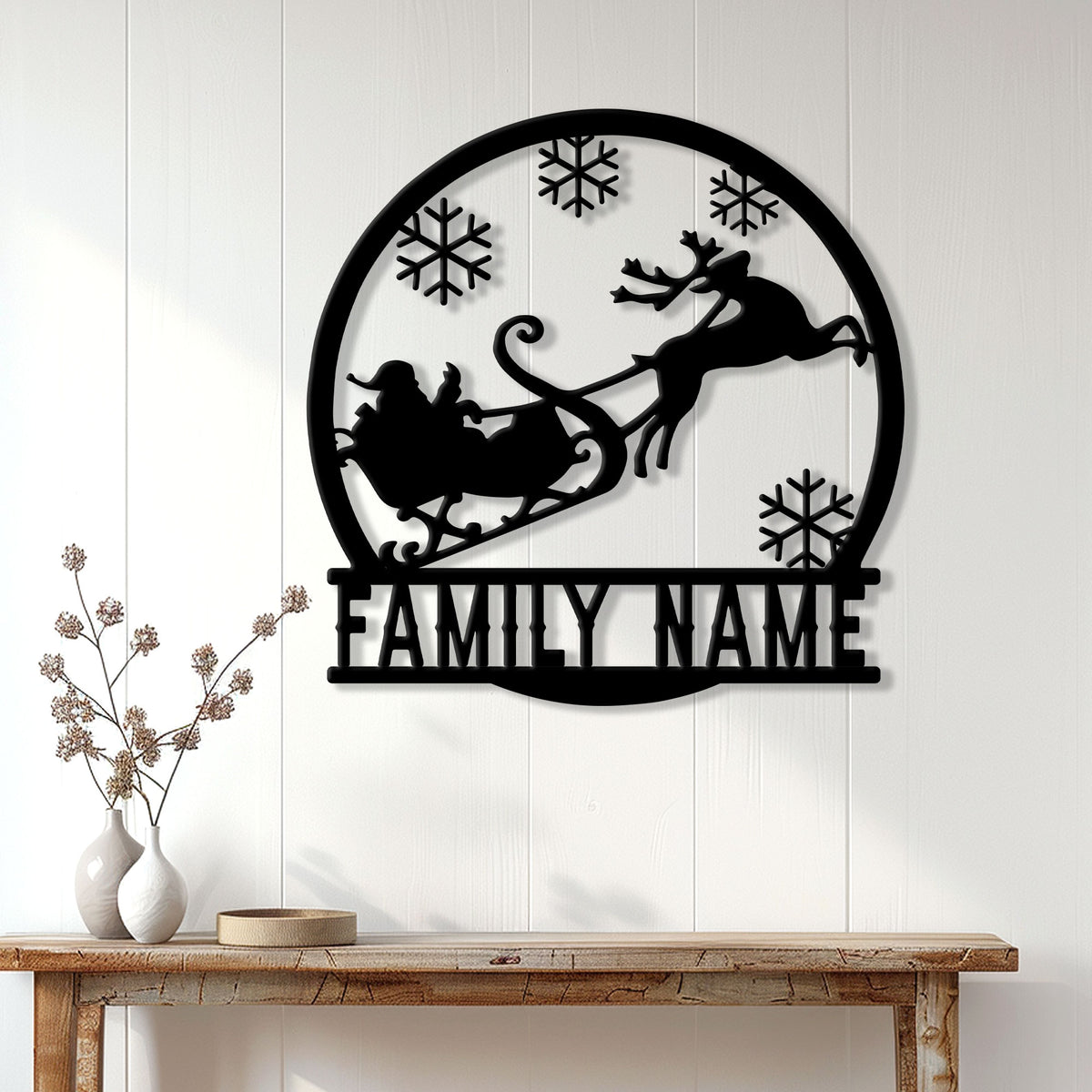 Custom Christmas family metal sign displayed on a white paneled wall above a rustic console table