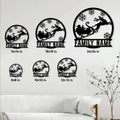 Christmas sleigh metal sign shown in multiple size options above a bright living room sofa