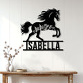 Black horse metal wall decor displayed on a light wood-paneled wall above a console table