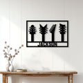 Black guitar headstock metal sign displayed on a white paneled wall above a wood console table