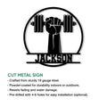 Weightlifting gym metal sign showcasing a powerful raised fist and barbell artwork