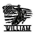 Custom cowboy metal sign featuring a rider on a rearing horse over a patriotic flag design