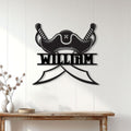 Pirate hat metal sign displayed on a white paneled wall above a rustic console table