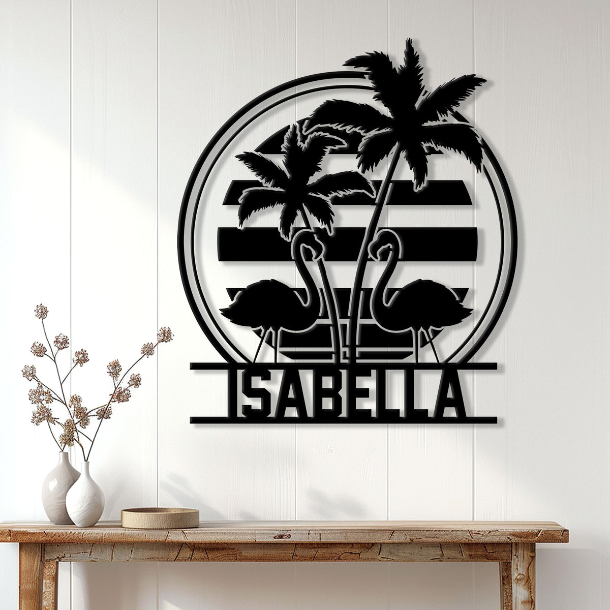 Black flamingo wall sign displayed on a light wood wall in a bright tropical-inspired living space