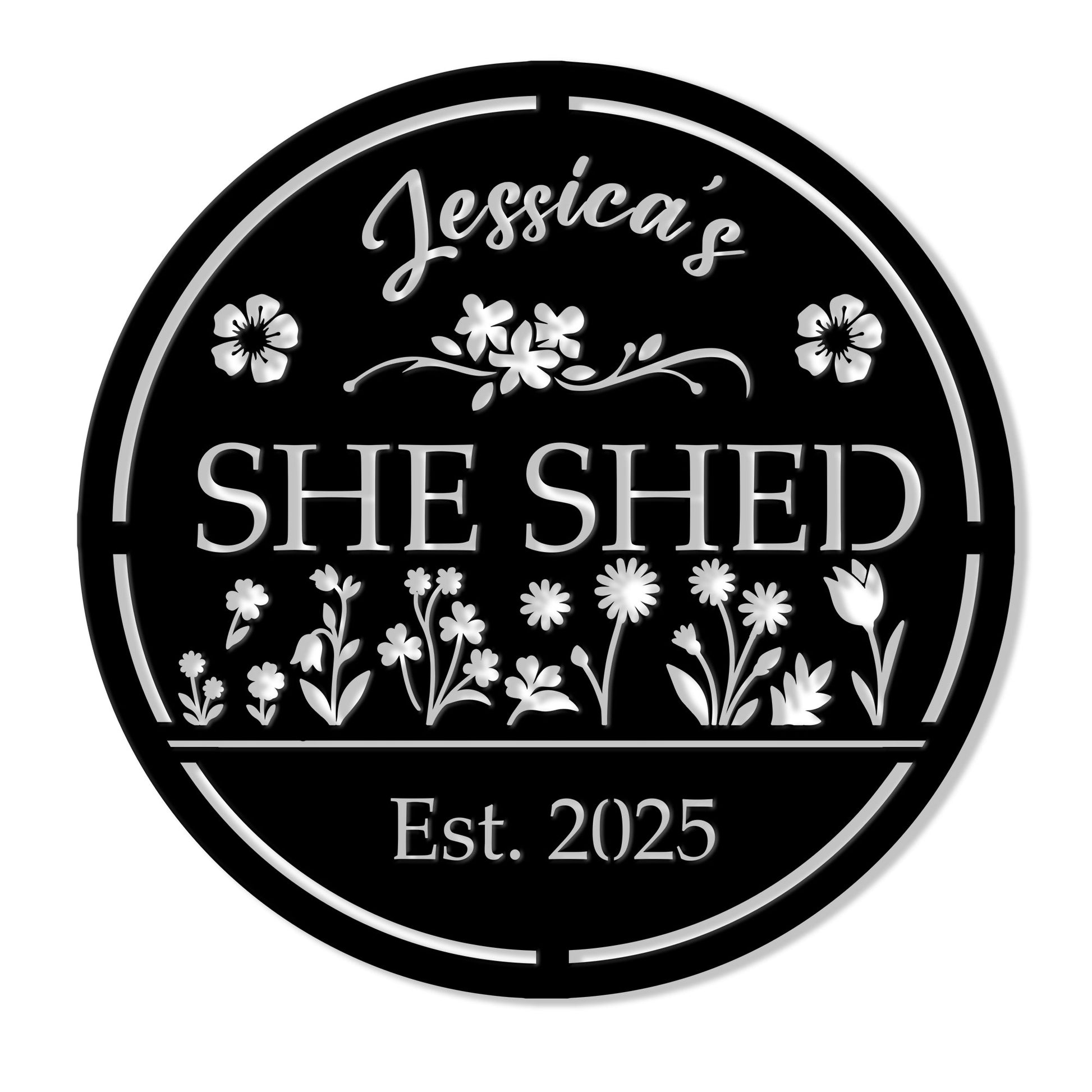 Round black She Shed metal sign with floral garden artwork and a decorative border