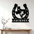 Custom Texas cowboy metal sign displayed on a light paneled wall above a console table